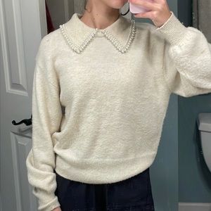 Woman’s pearl sweater